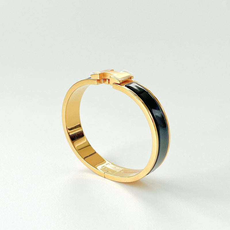Hermes Clic H Bracelet In Black And Gold - Found Fashion