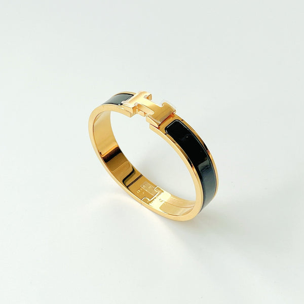 Hermes Clic H Bracelet In Black And Gold - Found Fashion