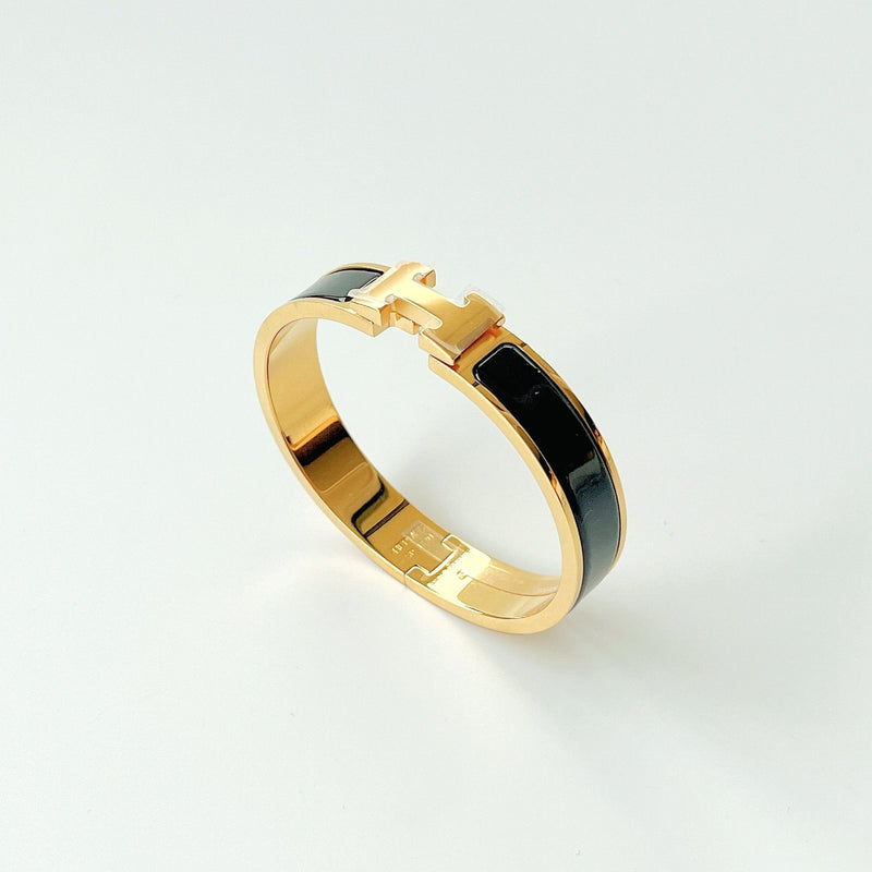 Hermes Clic H Bracelet In Black And Gold - Found Fashion