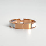 Hermès Clic H Bracelet In White and Rose Gold, PM Size